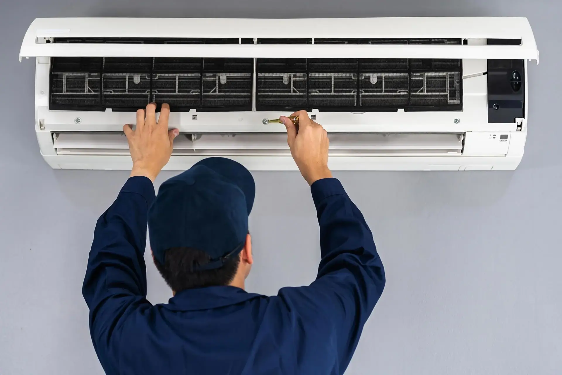 Technician cleaning AC ducts in a Dubai home